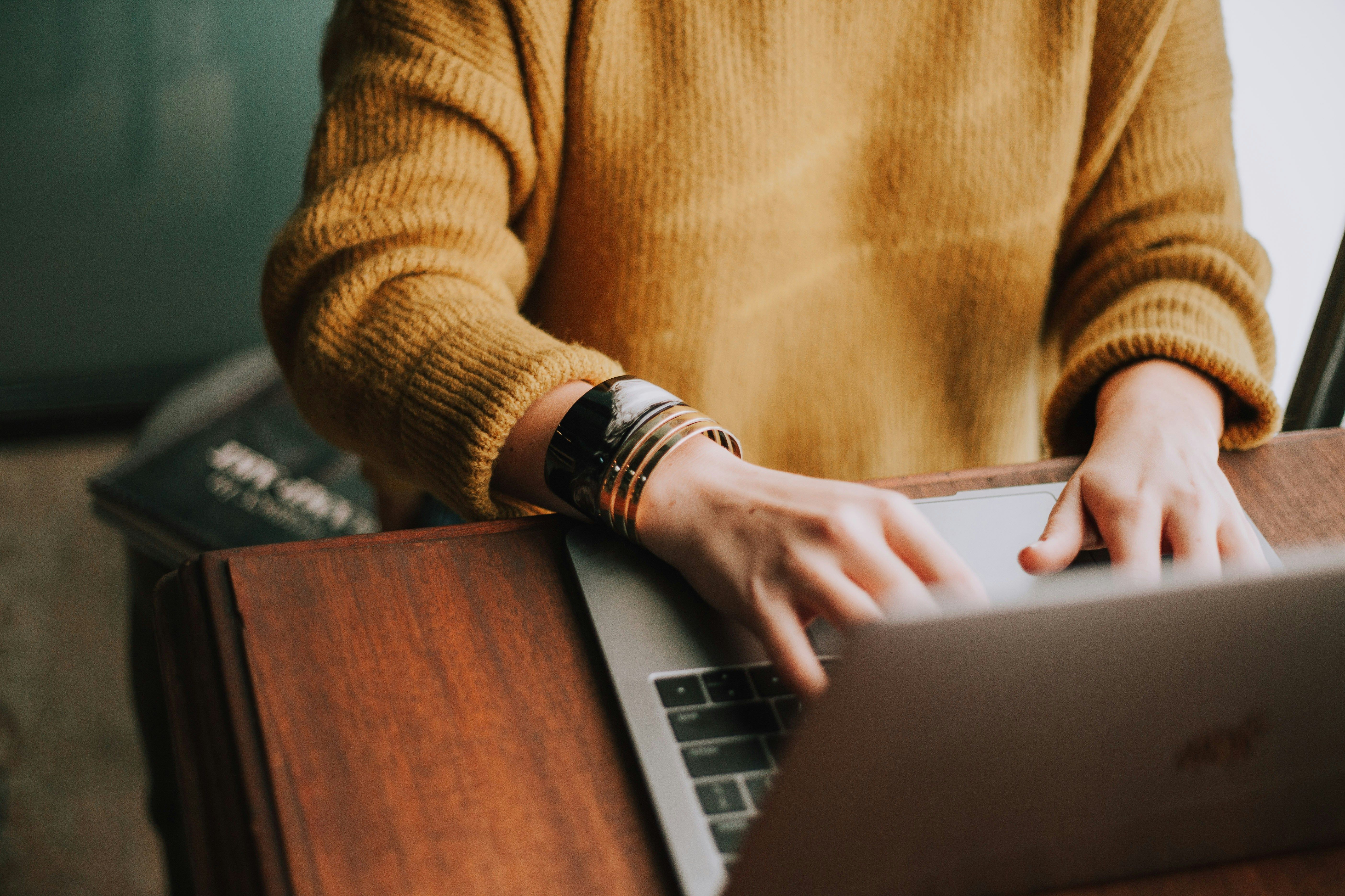 Woman with laptop signing up
